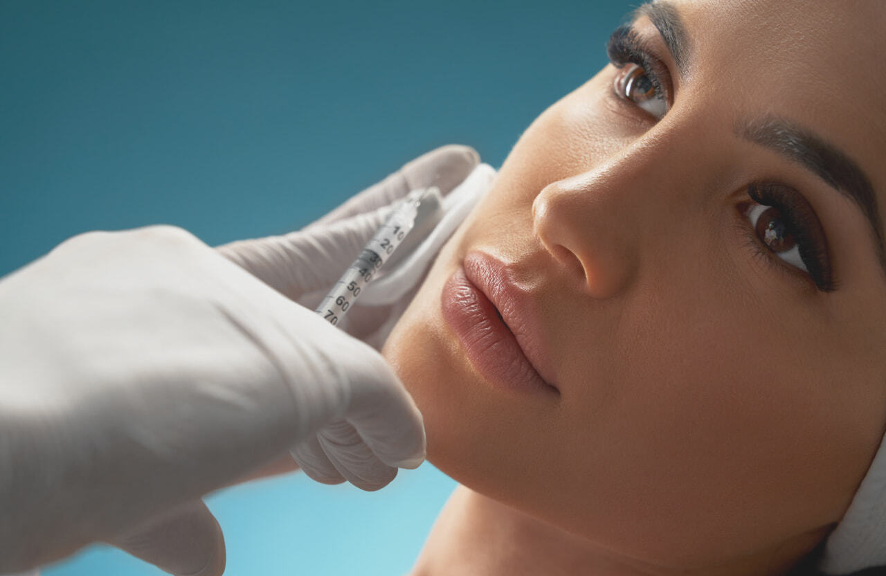 closeup of a young woman getting a soft filler injection