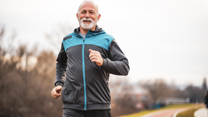 Older male adult running thanks to healthy joints.