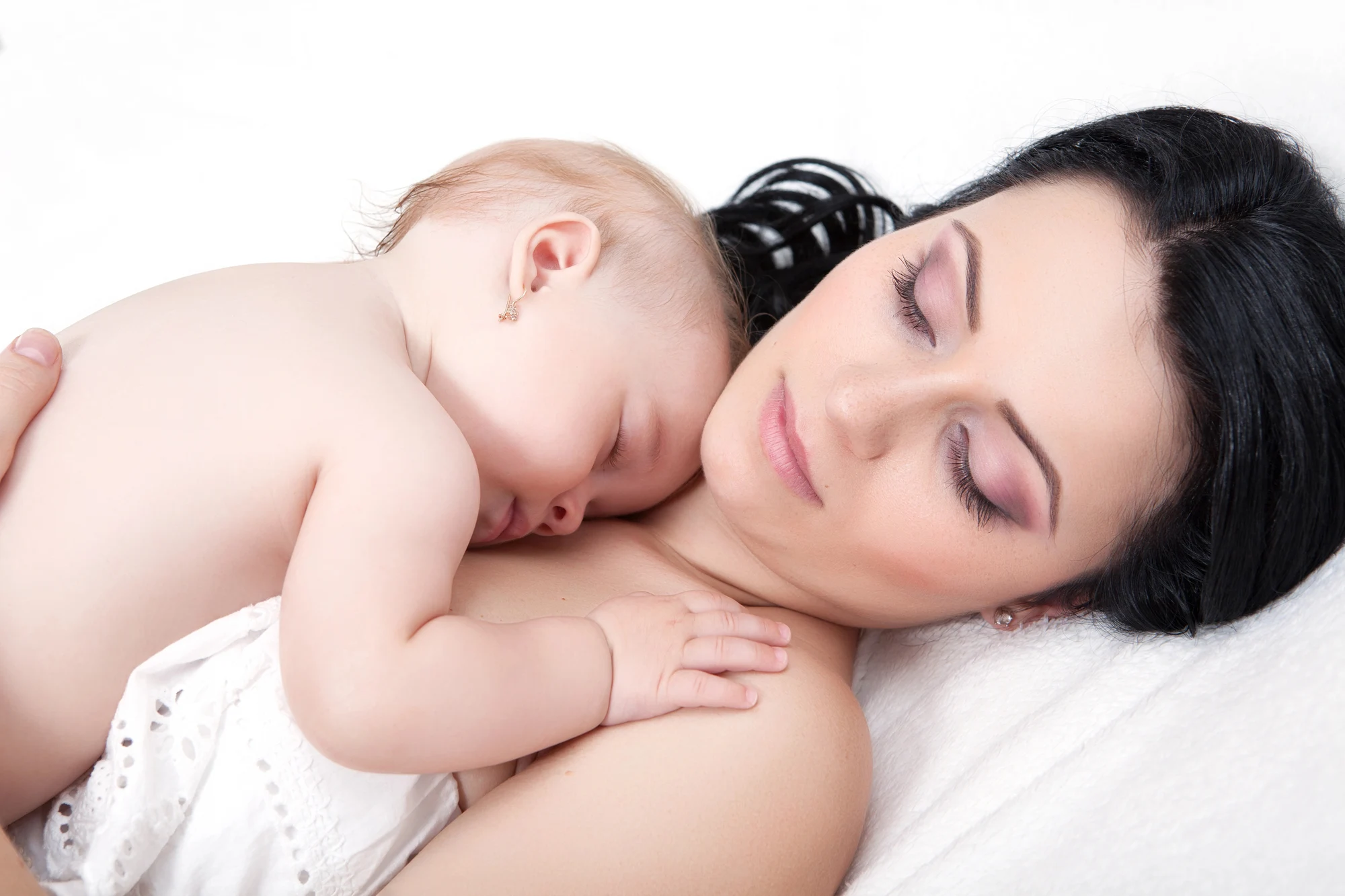mother holding a baby, thinking about the safety of botox while breastfeeding