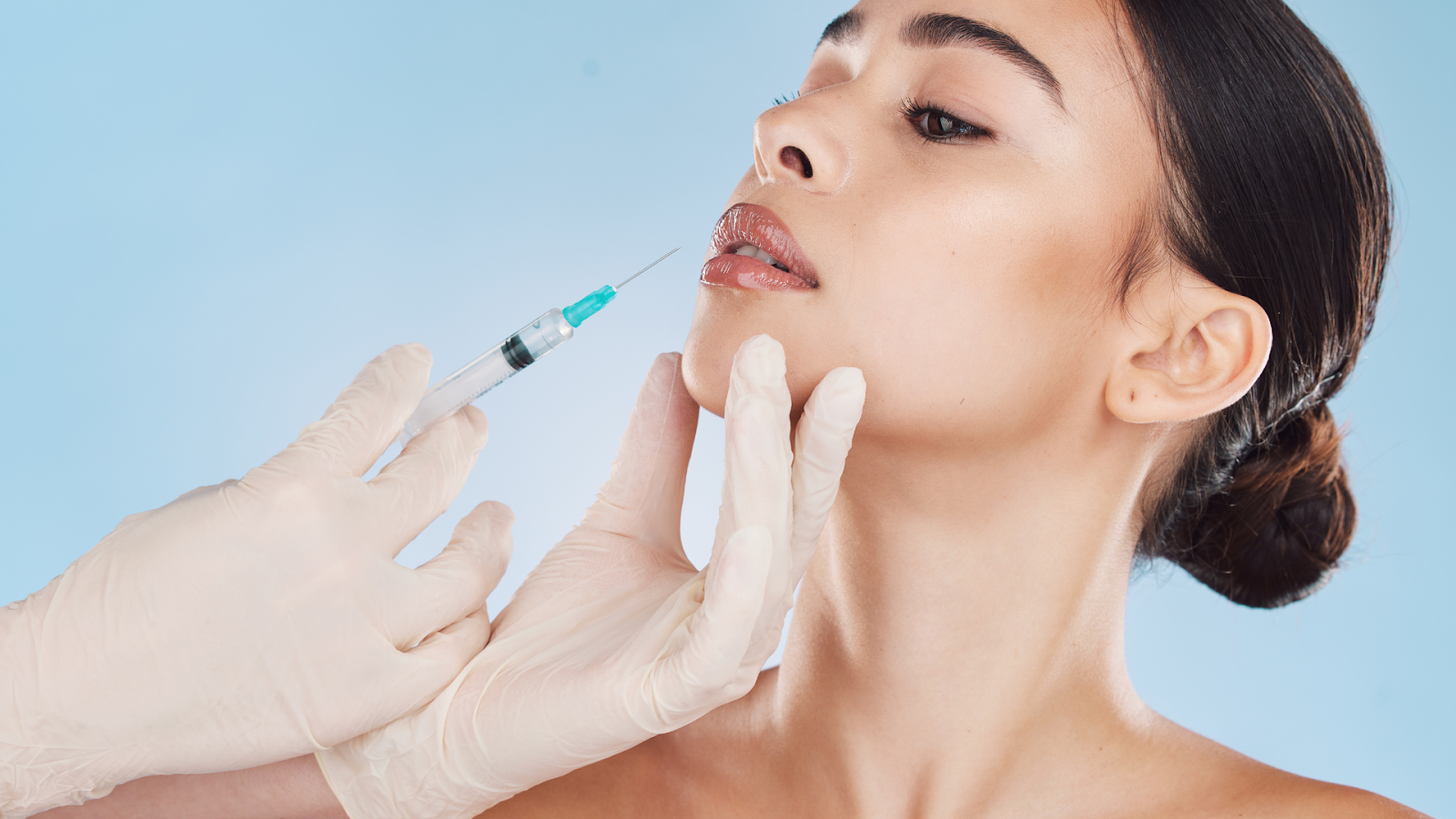 A female patient receives Restylane injections.